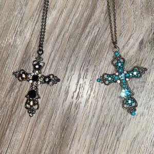 2 cross necklaces. One blue and one black